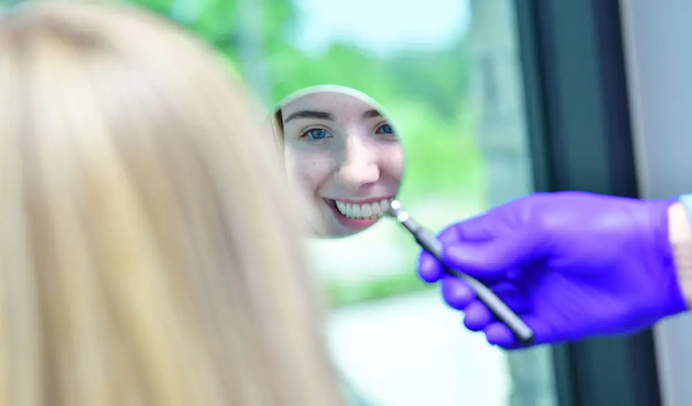 adult patient getting braces removed